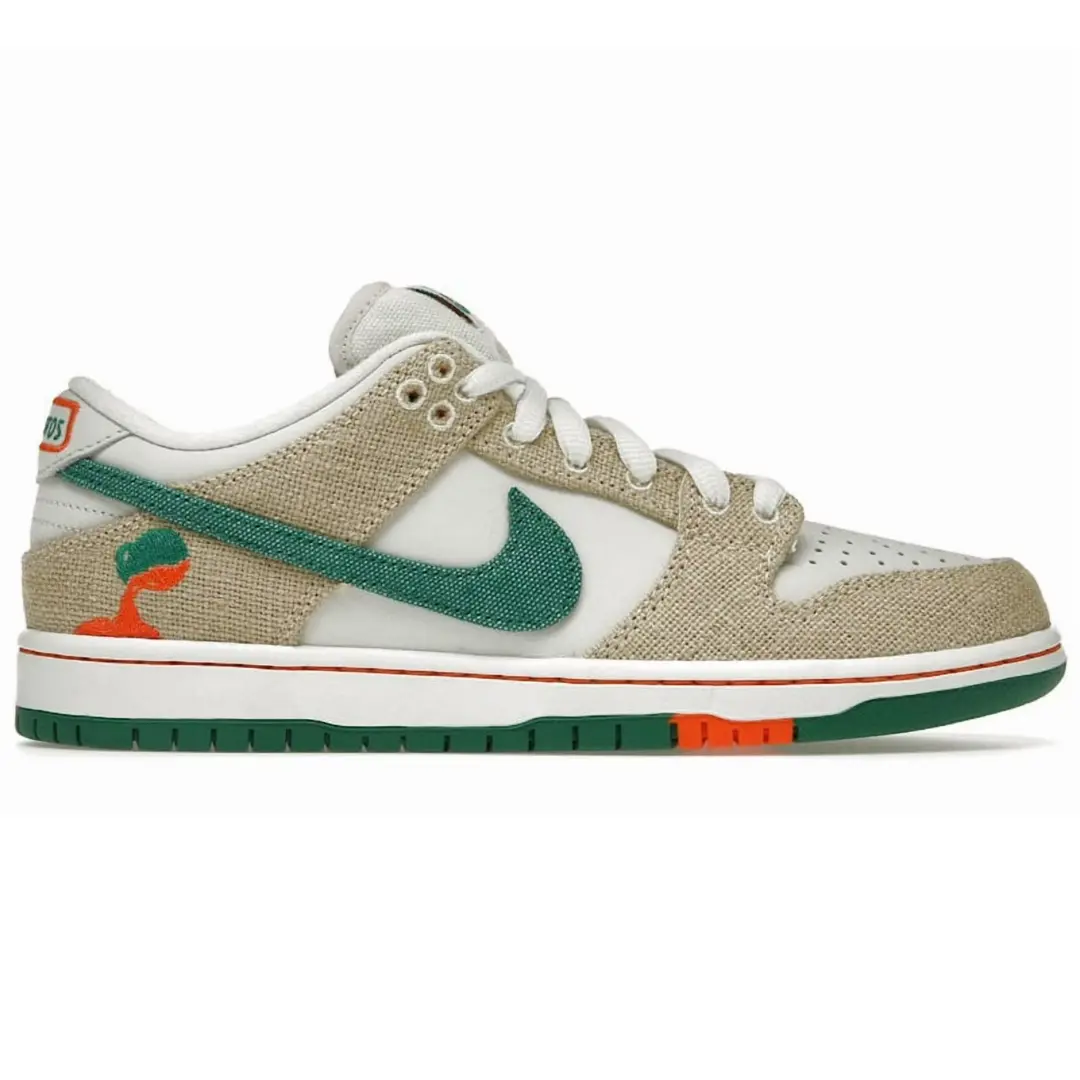 A Nike Dunk sneaker featuring a beige canvas upper, white leather overlays, a green Swoosh, and green and orange accents on the midsole and heel.